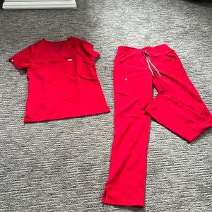 Figs pop red scrubs.